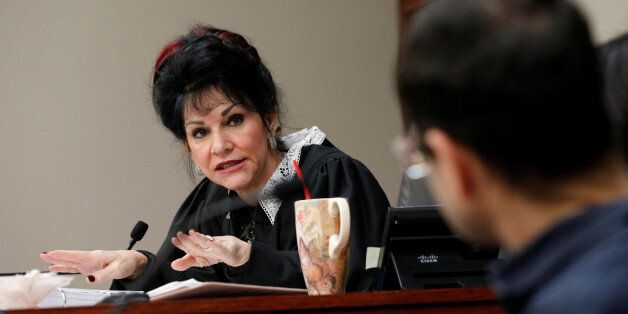 Circuit Court Judge Rosemarie Aquilina addresses Larry Nassar, (R) a former team USA Gymnastics doctor, who pleaded guilty in November 2017 to sexual assault charges, during his sentencing hearing in Lansing, Michigan, U.S., January 18, 2018. REUTERS/Brendan McDermid
