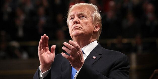 U.S. President Donald Trump applauds while delivering a State of the Union address to a joint session of Congress at the U.S. Capitol in Washington, D.C., U.S., on Tuesday, Jan. 30, 2018. Trump sought to connect his presidency to the nation's prosperity in his first State of the Union address, arguing that the U.S. has arrived at a 'new American moment' of wealth and opportunity. Photographer: Win McNamee/Pool via Bloomberg