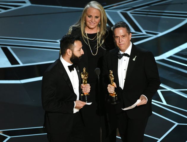 Filmmakers Adrian Molina, Darla K. Anderson and Lee Unkrich accept Best Animated Feature Film for 'Coco' onstage during the 90th Annual Academy Awards