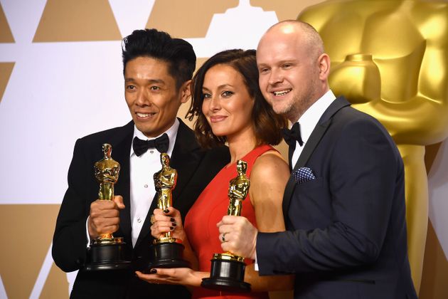 Make-up artists Kazuhiro Tsuji, Lucy Sibbick, and David Malinowski, winners of the Best Makeup and Hairstyling award for 'Darkest Hour,' pose in the press room during the 90th Annual Academy Awards 