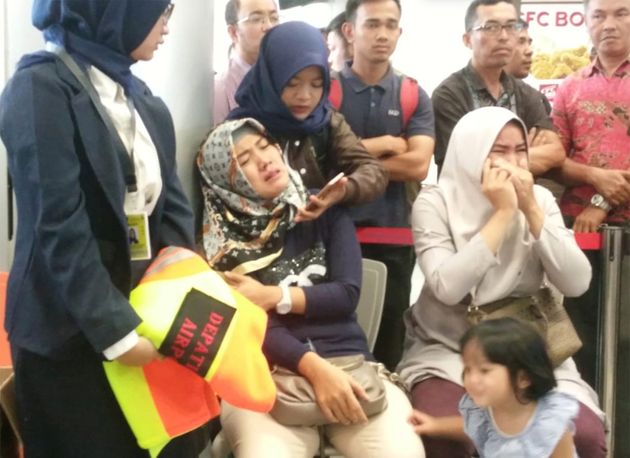 Relatives of passengers of Lion Air flight JT610 that crashed into the sea, cry at Depati Amir airport in Pangkal Pinang, Indonesia, October 29, 2018.