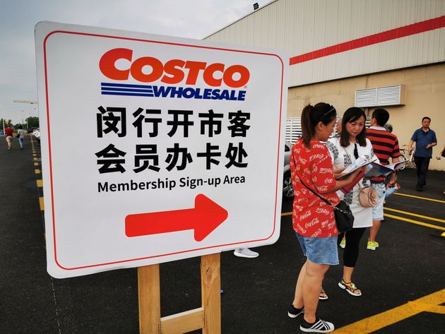 SHANGHAI, CHINA - AUGUST 24: People stand in front of a Costco store on August 24, 2019 in Shanghai, China. Costco Wholesale Corp. will open its first store in mainland China on August 27. (Photo by VCG/VCG via Getty Images)