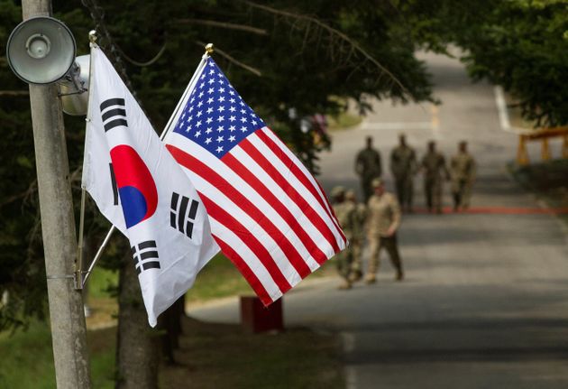 The South Korean and American flags fly next to each other at Yongin, South Korea, August 23, 2016. Picture taken on August 23, 2016.  Courtesy Ken Scar/U.S. Army/Handout via REUTERS    ATTENTION EDITORS - THIS IMAGE HAS BEEN SUPPLIED BY A THIRD PARTY.