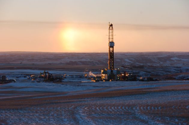 In this Feb. 25, 2015 photo, a drilling rig is seen near Epping, N.D. A team led by researchers at the University of Michigan has found that fossil fuel production at the Bakken Formation in North Dakota and Montana is emitting roughly 2 percent of the ethane detected in the Earth's atmosphere. Along with its chemical cousin methane, ethane is a hydrocarbon that is a significant component of natural gas. Once in the atmosphere, ethane reacts with sunlight to form ozone.(AP Photo/Matthew Brown)