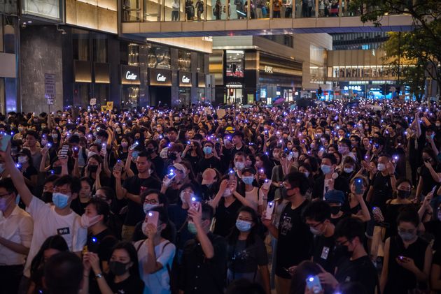 CENTRAL, HONG KONG, HONG KONG ISLAND, CHINA - 2019/08/28: Protesters raise purple lights during the demonstration.
Thousands of anti-government protesters attended the metoo rally, where various leaders spoke out against the acts of sexual violence committed by the Hong Kong police during anti-extradition protests. Protesters shined purple-colored lights in support of the metoo movement while holding up various placards criticizing the police. (Photo by Aidan Marzo/SOPA Images/LightRocket via Getty Images)