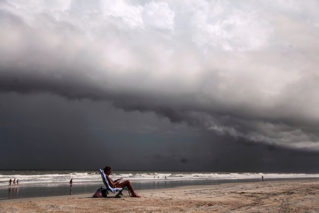 Tricia Cheshire, a resident of Amelia Island sunbathes for the last few minutes before storms hit the coast before Hurricane Dorian in Jacksonville, Florida, U.S. September 1, 2019. REUTERS/Maria Alejandra Cardona TPX IMAGES OF THE DAY
