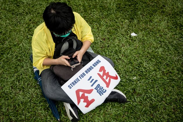 HONG KONG, CHINA - SEPTEMBER 02: A protester participates in a school boycott rally at Tamer Park in Central district on September 2, 2019 in Hong Kong, on September 02, 2019 in Hong Kong, China. Pro-democracy protesters have continued demonstrations across Hong Kong since 9 June against a controversial bill which allows extraditions to mainland China as the ongoing protests surpassed the Umbrella Movement five years ago, becoming the biggest political crisis since Britain handed its onetime colony back to China in 1997. Hong Kong's embattled leader Carrie Lam apologized for introducing the bill and declared it 'dead', however the campaign continues to draw large crowds to voice their discontent while many end up in violent clashes with the police as protesters show no signs of stopping. (Photo by Chris McGrath/Getty Images)