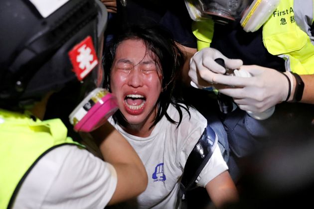 An anti-extradition bill protester receives medical attention after tear gas and pepper spray was used by riot police during a protest, outside Mong Kok police station, in Hong Kong, China September 2, 2019. REUTERS/Tyrone Siu     TPX IMAGES OF THE DAY