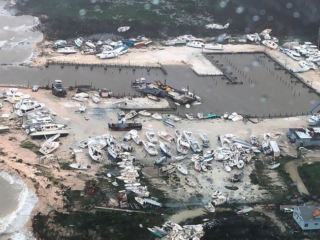 In this Monday, Sept. 2, 2019 photo released by the U.S. Coast Guard Station Clearwater, boats litter the area around marina in the Bahamas after they were tossed around by Hurricane Dorian. The storm pounded away at the islands in a watery onslaught that devastated thousands of homes, trapped people in attics and chased others from one shelter to another. At least five deaths were reported. (U.S. Coast Guard Station Clearwater via AP)
