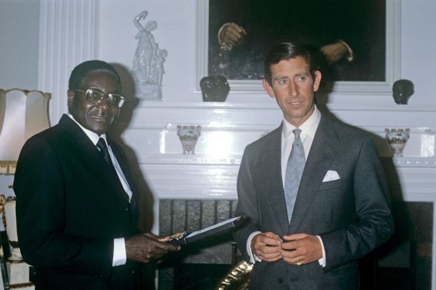 File photo dated 19/4/1980 of the Prince of Wales receiving an Independence Medal from Robert Mugabe, the Prime Minister of the newly independent Zimbabwe, during a dinner at Government House, Salisbury. Mr Mugabe has died aged 95.