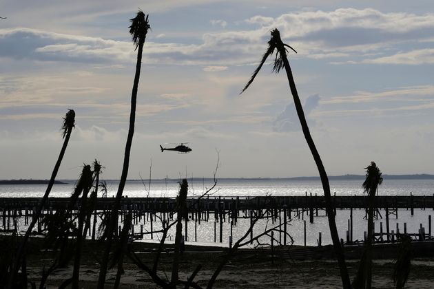 An unidentified helicopter lands to deliver food and water in the aftermath of Hurricane Dorian on the Great Abaco island town of Marsh Harbour, Bahamas, September 4, 2019. REUTERS/Dante Carrer