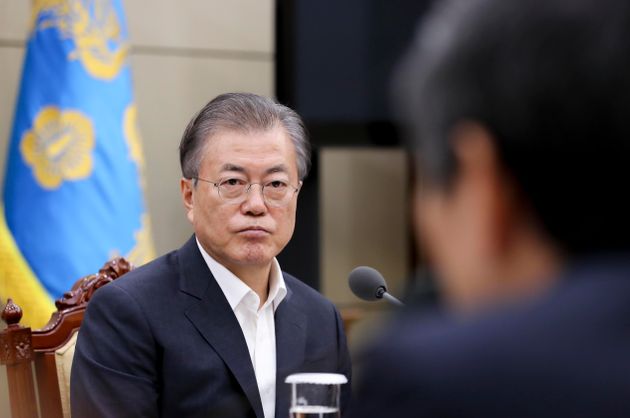 SEOUL, SOUTH KOREA - AUGUST 22: In this handout image provided by South Korean Presidential Blue House, South Korean President Moon Jae-in listens to a report from officials related to the General Security of Military Information Agreement (GSOMIA) with Japan at a National Security Council meeting at the Presidential Blue House on August 22, 2019 in Seoul, South Korea. South Korea announced that it was scrapping the intelligence-sharing arrangement with Japan due to changes in security cooperation conditions. (Photo by South Korean Presidential Blue House via Getty Images)