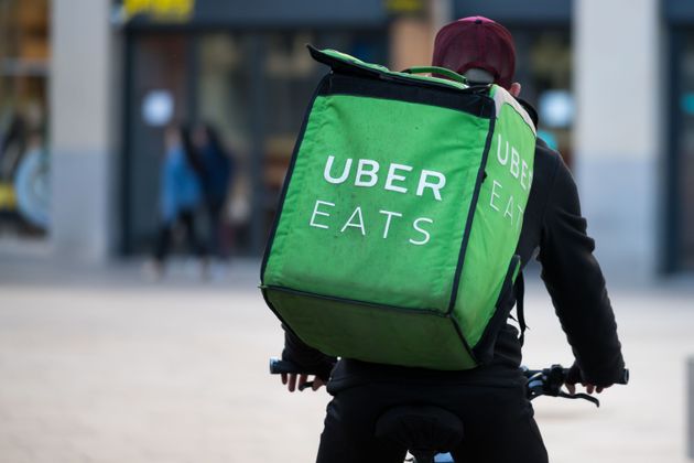CARDIFF, UNITED KINGDOM - MAY 21: A Uber Eats worker rides a bike through the city centre on May 21, 2019 in Cardiff, United Kingdom. (Photo by Matthew Horwood/Getty Images)