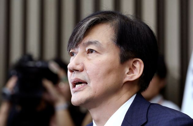 In this Sept. 2, 2019 photo, Cho Kuk, a nominee for South Korea's Justice Minister, answers a reporter's question at National Assembly in Seoul, South Korea. South Korean reporters have grilled President Moon Jae-in's nominee as justice minister for 11 hours over suspected ethical lapses surrounding his family that have triggered an intense political row and cut into Moon's popularity ratings.(Kim Ju-hyung/Yonhap via AP)
