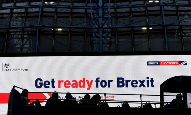 A bus passes an electronic billboard displaying a British government Brexit information awareness campaign advertisement in London, Britain, September 11, 2019. REUTERS/Toby Melville.