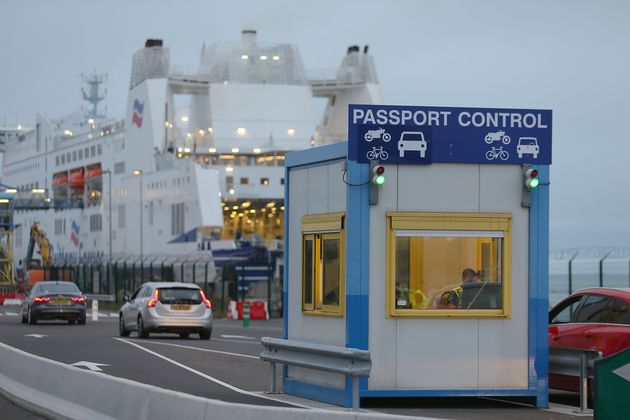 A French custom officer works in a booth at the transit zone at the port of Ouistreham, Normandy, Thursday, Sept.12, 2019. France has trained 600 new customs officers and built extra parking lots arounds its ports to hold vehicles that will have to go through extra checks if there is no agreement ahead of Britain's exit from the EU, currently scheduled on Oct. 31. (AP Photo/David Vincent)