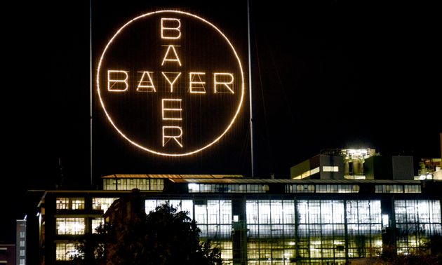 The Bayer logo shines at night at the main chemical plant of German Bayer AG on Thursday, Aug. 9, 2019 in Leverkusen, Germany. The company faces about 18,400 lawsuits against subsidiary Monsanto over its glyphosate-based weedkiller Roundup in the United States. Bayer acquired Monsanto for $63 billion last year. (AP Photo/Martin Meissner)