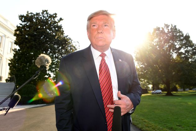 President Donald Trump talks with reporters before leaving on Marine One on the South Lawn of the White House in Washington, Sunday, Sept. 22, 2019. Trump is traveling to Texas and Ohio before heading to New York to attend the upcoming United Nations General Assembly. (AP Photo/Susan Walsh)