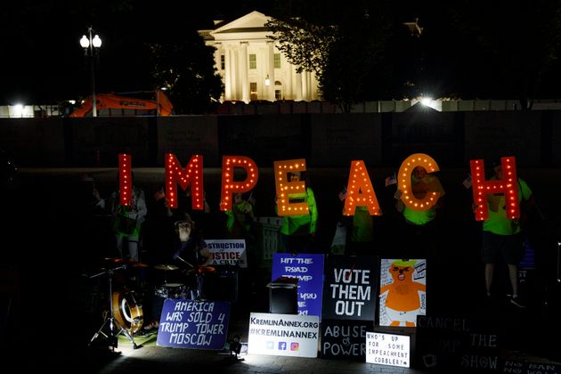 Protesters with 'Kremlin Annex' call to impeach President Donald Trump in Lafayette Square Park in front of the White House in Washington, Tuesday, Sept. 24, 2019. House Speaker Nancy Pelosi of Calif., announced a formal impeachment inquiry into President Donald Trump. (AP Photo/Carolyn Kaster)