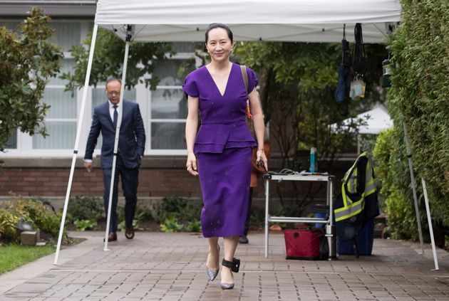 Huawei chief financial officer Meng Wanzhou, who is out on bail and remains under partial house arrest after she was detained last year at the behest of American authorities, wears an electronic monitoring bracelet on her ankle as she leaves her home to attend a court hearing in Vancouver, on Monday September 23, 2019. (Darryl Dyck/The Canadian Press via AP)