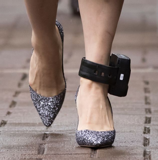 Huawei chief financial officer Meng Wanzhou, who is out on bail and remains under partial house arrest after she was detained last year at the behest of American authorities, wears an electronic monitoring bracelet on her ankle as she leaves her home to attend a court hearing in Vancouver, on Monday September 23, 2019. (Darryl Dyck/The Canadian Press via AP)