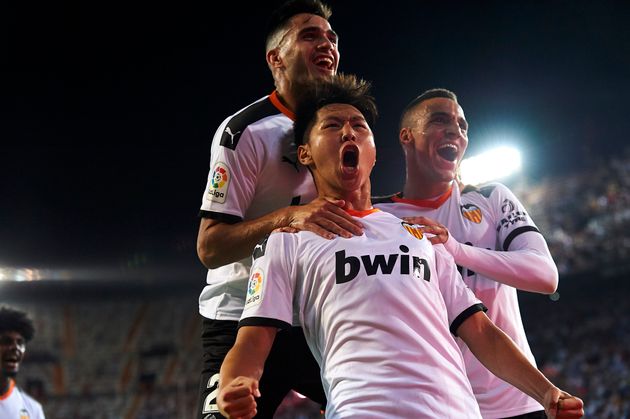 Kang-in Lee of Valencia celebrates whit Rodrigo Moreno and Maxi Gomez after scoring his sides first goal during the Liga match between Valencia CF  and Getafe CF at Estadio Mestalla on September 25, 2019 in Valencia, Spain. (Photo by Jose Breton/Pics Action/NurPhoto via Getty Images)