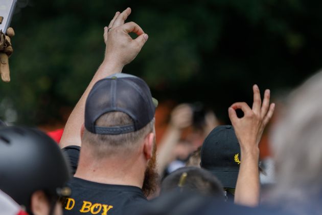 A member of the far-right group 'Proud Boys' makes the OK hand gesture believed to have white supremacist connotations during 'The End Domestic Terrorism' rally at Tom McCall Waterfront Park on August 17, 2019 in Portland, Oregon. - No major incidents were reported on Saturday afternoon in Portland (western USA) during a far-right rally and far-left counter-demonstration, raising fears of violent clashes between local authorities and US President Donald Trump, who was monitoring the event 'very closely'. (Photo by John Rudoff / AFP)        (Photo credit should read JOHN RUDOFF/AFP/Getty Images)