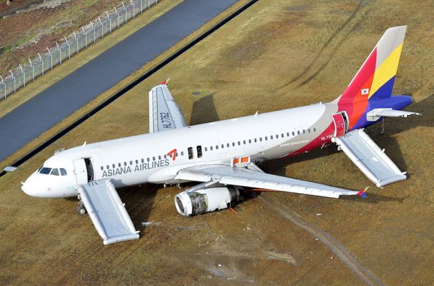 An aerial view shows an Asiana Airlines airplane which ran out of runway after landing at Hiroshima airport in Mihara, Hiroshima prefecture, western Japan, in this photo taken by Kyodo April 15, 2015. An investigation has been launched after the Asiana Airlines passenger jet skidded off the runway after landing at Japan's Hiroshima airport on Tuesday, local media reported. The Airbus A320 jet was arriving from the South Korean capital of Seoul when it ran off the runway and slid onto an embankment shortly after 8pm local time (1100 GMT). Mandatory credit REUTERS/Kyodo 

ATTENTION EDITORS - FOR EDITORIAL USE ONLY. NOT FOR SALE FOR MARKETING OR ADVERTISING CAMPAIGNS. THIS IMAGE HAS BEEN SUPPLIED BY A THIRD PARTY. IT IS DISTRIBUTED, EXACTLY AS RECEIVED BY REUTERS, AS A SERVICE TO CLIENTS. MANDATORY CREDIT. JAPAN OUT. NO COMMERCIAL OR EDITORIAL SALES IN JAPAN.

TPX IMAGES OF THE DAY