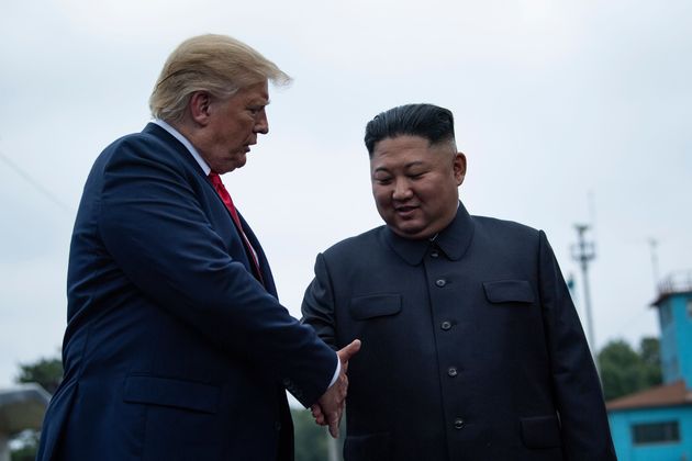 US President Donald Trump and North Korea's leader Kim Jong-un shake hands before a meeting in the Demilitarized Zone (DMZ) on June 30, 2019. (Photo by Brendan Smialowski / AFP)        (Photo credit should read BRENDAN SMIALOWSKI/AFP/Getty Images)