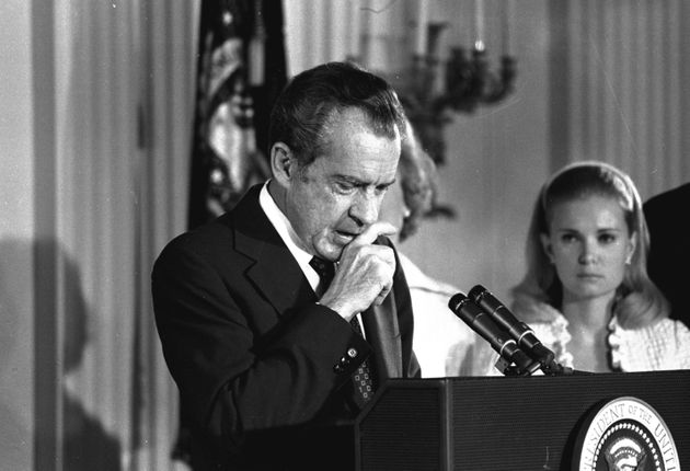 Richard Nixon performs the last acts of his devastated presidency in the White House East Room, August 9, 1974, as he bids farewell to his Cabinet, aides, and staff.  Nixon said only a man in the deepest valley can know how magnificent it is to be on the highest mountain.  (AP Photo)