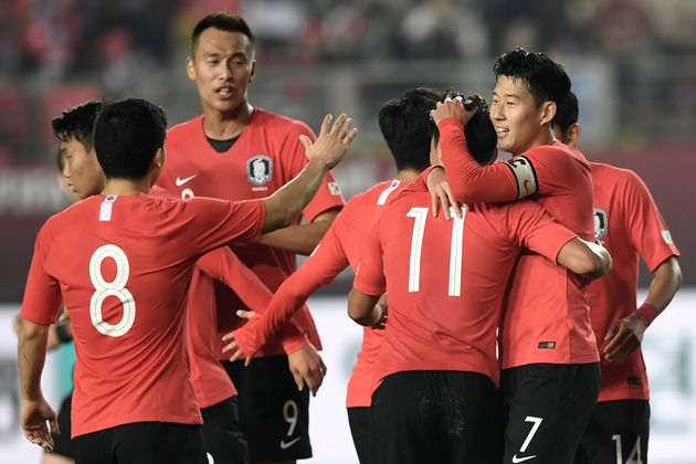 South Korea's Son Heung-min (R) celebrates his goal with teammates against Sri Lanka during their World Cup 2022 Qualifying Asian zone Group H football match between South Korea and Sri Lanka in Hwaseong on October 10, 2019. (Photo by Jung Yeon-je / AFP) (Photo by JUNG YEON-JE/AFP via Getty Images)