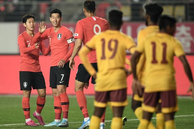 South Korea's Son Heung-min (2nd L) celebrates his goal with teammates against Sri Lanka during their World Cup 2022 Qualifying Asian zone Group H football match between South Korea and Sri Lanka in Hwaseong on October 10, 2019. (Photo by Jung Yeon-je / AFP) (Photo by JUNG YEON-JE/AFP via Getty Images)