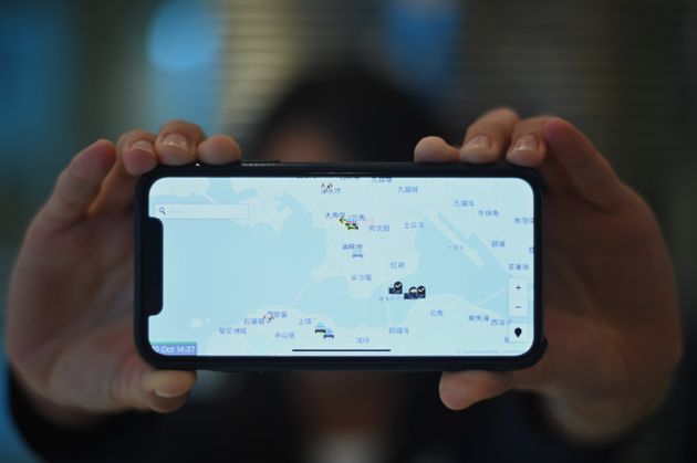 This photo illustration shows a smartphone displaying the 'HKmap.live' app in Hong Kong on October 10, 2019. - Apple on October 10 removed an app criticised by China for allowing protesters in Hong Kong to track police, as Beijing steps up pressure on foreign companies deemed to be providing support to the pro-democracy movement. (Photo by Philip FONG / AFP) (Photo by PHILIP FONG/AFP via Getty Images)