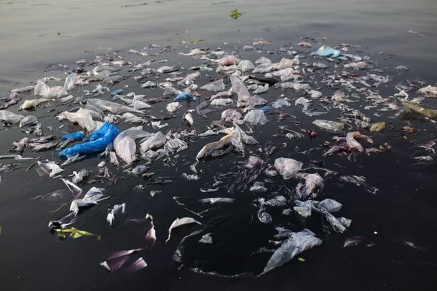 Dhaka, Bangladesh- November 12, 2018: Plastic bags are seen in Buringanga River in Dhaka, Bangladesh on November 12, 2018.