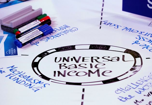 Universal Basic Income (UBI) s written on a table during a session at the World Economic Forum (WEF) annual meeting in Davos, Switzerland January 23, 2018  REUTERS/Denis Balibouse