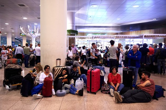 BARCELONA, SPAIN - OCTOBER 14: Passengers strand at the Barcelona Airport as thousands of protestors block the access in a protest following the sentencing of nine Catalan separatist leaders on October 14, 2019 in Barcelona, Spain. Spain's Supreme Court has sentenced nine Catalan separatist leaders to between nine and 13 years in prison over their role in the 2017 Catalan independence referendum. (Photo by Alex Caparros/Getty Images)