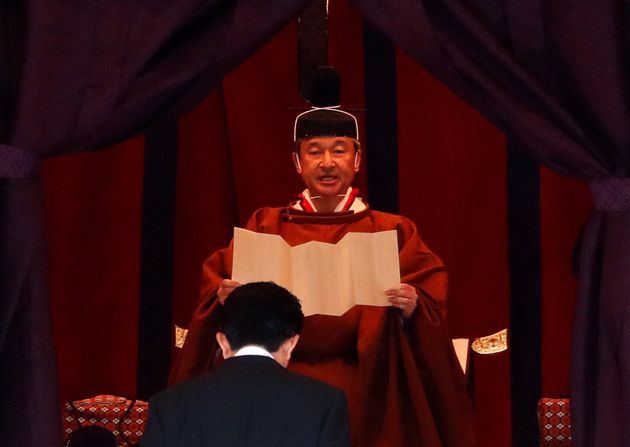 Emperor Naruhito speaks near Japan's Prime Minister Shinzo Abe during a ceremony to proclaim his enthronement to the world, called Sokuirei-Seiden-no-gi, at the Imperial Palace in Tokyo, Japan October 22, 2019. REUTERS/Issei Kato/Pool