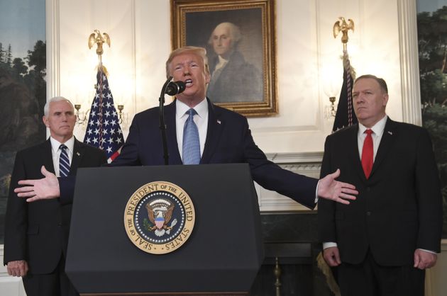US President Donald Trump speaks about Syria, next to US Vice President Mike Pence(L) and US Secretary of State Mike Pompeo(R) in the Diplomatic Reception Room at the White House in Washington, DC, October 23, 2019. (Photo by SAUL LOEB / AFP) (Photo by SAUL LOEB/AFP via Getty Images)