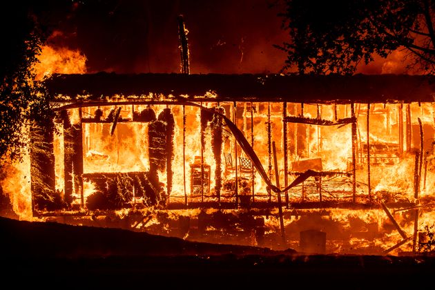 Flames consume a home as the Kincade Fire tears through the Jimtown community of Sonoma County, Calif., on Thursday, Oct. 24, 2019. (AP Photo/Noah Berger)