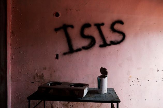 Burnt kitchen items are seen in front of a wall spray-painted with the word 'ISIS' in a home in the most affected war-torn area of Marawi City, Lanao province, Philippines, May 11, 2019.  The city remains abandoned two years after pro-Islamic State militants began their attacks on May 23, 2017. REUTERS/Eloisa Lopez
