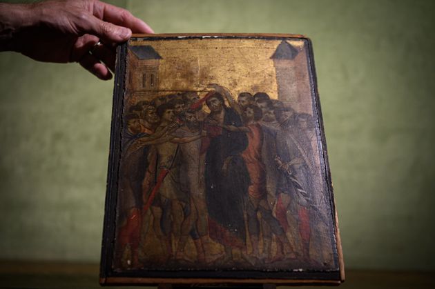 TOPSHOT - This photo taken on September 23, 2019 in Paris shows a painting entitled 'the Mocking of Christ' by the late 13th century Florentine artist Cenni di Pepo also known as Cimabue. - The painting will be auctioned in Senlis on October 27, 2019. (Photo by Philippe LOPEZ / AFP) (Photo by PHILIPPE LOPEZ/AFP via Getty Images)