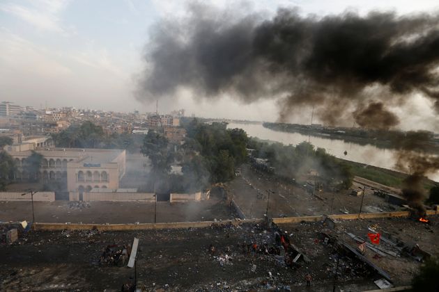 Smoke rises over Baghdad, during a protest over corruption, lack of jobs, and poor services, in Baghdad, Iraq October 27, 2019. REUTERS/Thaier Al-Sudani