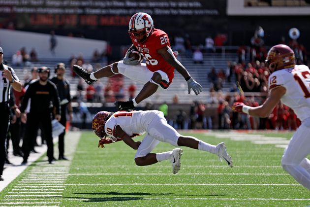 Texas Tech's Ta'Zhawn Henry (26) hurdles over Iowa State's Tayvonn Kyle (10) during the second half of an NCAA college football game Saturday, Oct. 19, 2019, in Lubbock, Texas. (Brad Tollefson/Lubbock Avalanche-Journal via AP)