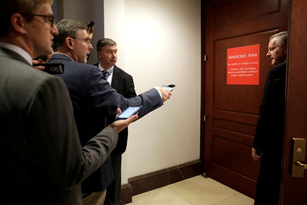 Congressman Mark Meadows (R-NC) looks back at reporters as he enters a secure area as Deputy Assistant Secretary of Defense Laura Cooper testifies in a closed-door deposition as part of the U.S. House of Representatives impeachment inquiry into U.S. President Donald Trump on Capitol Hill in Washington, U.S., October 23, 2019. REUTERS/Yuri Gripas     TPX IMAGES OF THE DAY