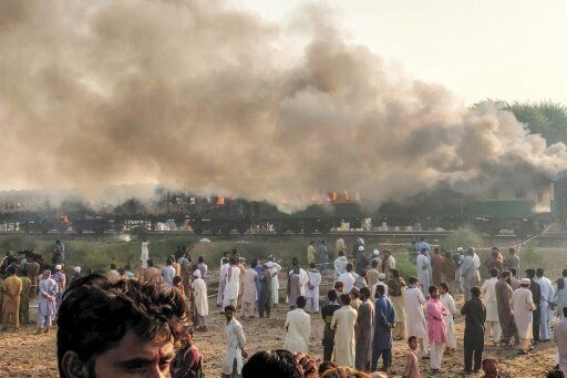 Some of the passengers -- many of whom were religious pilgrims travelling to a congregation in the eastern city of Lahore -- had been cooking breakfast when two of their gas cylinders exploded, officials said At least 65 people were killed and dozens wounded after a passenger train erupted in flames in central Pakistan on October 31, a provincial minister said