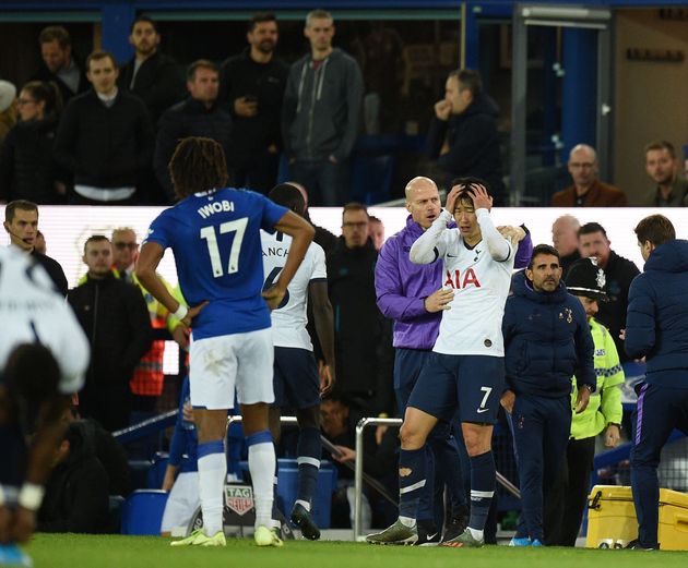 Tottenham Hotspur's South Korean striker Son Heung-Min (C) reacts after his involvement in an incident that resulted in an injury to Everton's Portuguese midfielder André Gomes during the English Premier League football match between Everton and Tottenham Hotspur at Goodison Park in Liverpool, north west England on November 3, 2019. (Photo by Oli SCARFF / AFP) / RESTRICTED TO EDITORIAL USE. No use with unauthorized audio, video, data, fixture lists, club/league logos or 'live' services. Online in-match use limited to 120 images. An additional 40 images may be used in extra time. No video emulation. Social media in-match use limited to 120 images. An additional 40 images may be used in extra time. No use in betting publications, games or single club/league/player publications. /  (Photo by OLI SCARFF/AFP via Getty Images)
