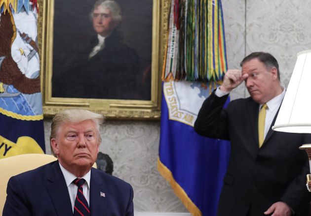U.S. President Donald Trump listens during a meeting with Italy's President Sergio Mattarella as U.S. Secretary of State Mike Pompeo looks on in the Oval Office of the White House in Washington, U.S., October 16, 2019. REUTERS/Jonathan Ernst