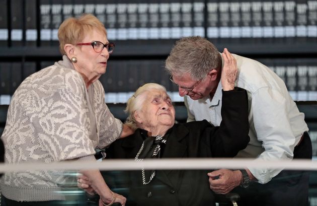 Greek World War II rescuer Melpomeni Dina (C) reacts as she is reunited with holocaust survivors Yossi Mor (R) and his sister Sarah Yanai, whom she helped escape in 1943, at the Hall of Names at the Yad Vashem Holocaust Memorial museum in Jerusalem on November 3, 2019. (Photo by Emmanuel DUNAND / AFP) (Photo by EMMANUEL DUNAND/AFP via Getty Images)