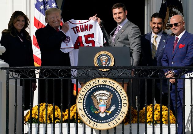 WASHINGTON, DC - NOVEMBER 04:  First baseman Ryan Zimmerman presents a Nationals jersey to U.S. President Donald Trump as he Trump welcomes the 2019 World Series Champions, the Washington Nationals, to the White House November 4, 2019 in Washington, DC. The Nationals are Washington’s first Major League Baseball team to win the World Series since 1924. Also pictured (L-R) are first lady Melania Trump, Nationals Manager Davey Martinez and Nationals General Manager Mike Rizzo. (Photo by Win McNamee/Getty Images)