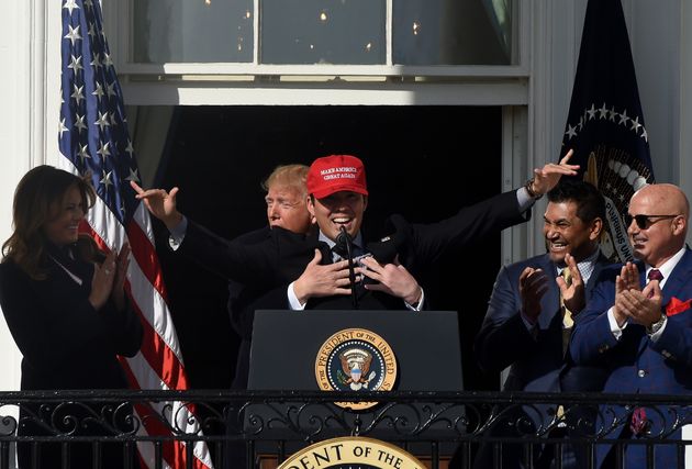Baseball player Kurt Suzuki wears a 'Make America Great Again' hat as US President Donald Trump and First Lady Melania Trump welcome the 2019 World Series Champions, The Washington Nationals, to the White House on November 4, 2019 in Washington,DC. (Photo by Olivier Douliery / AFP) (Photo by OLIVIER DOULIERY/AFP via Getty Images)